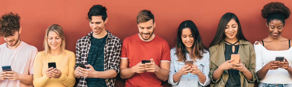 Group young people using mobile smartphone outdoor