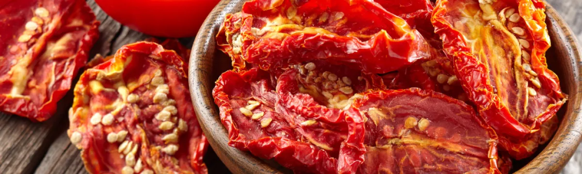 Fresh and sundried tomatoes in a bowl